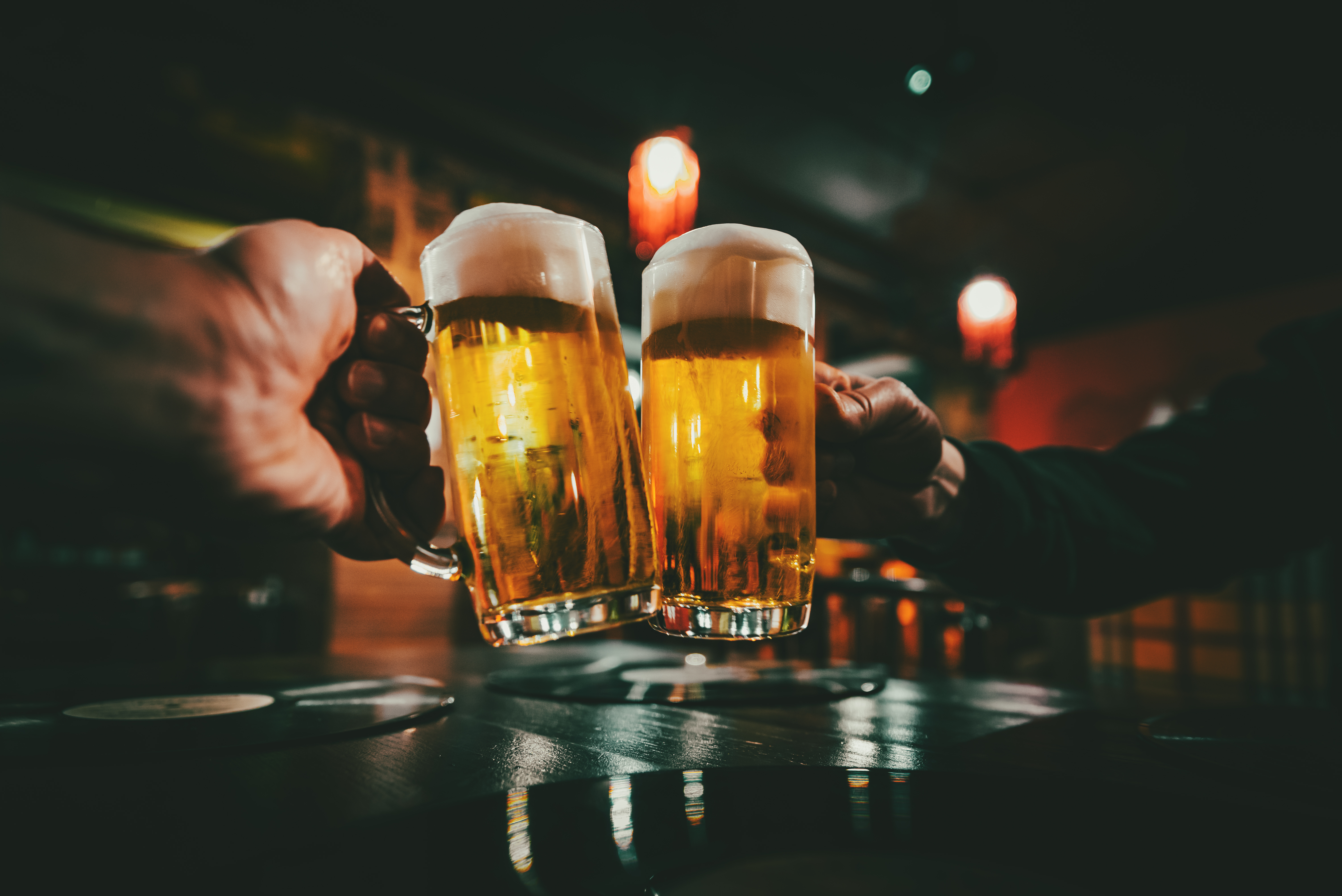 Two beers raised in a toast